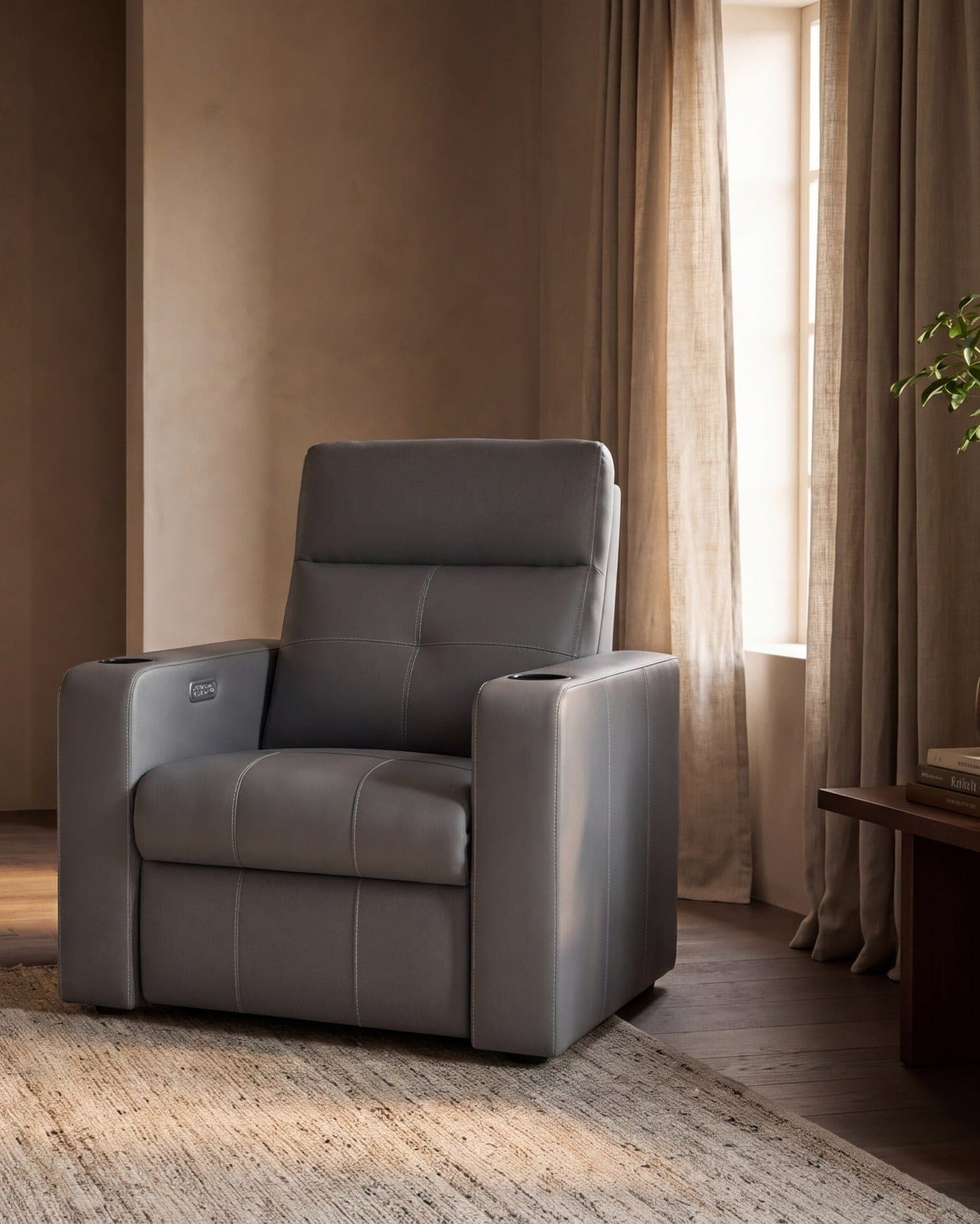 The Astra cinema recliner in a warm, dim media room