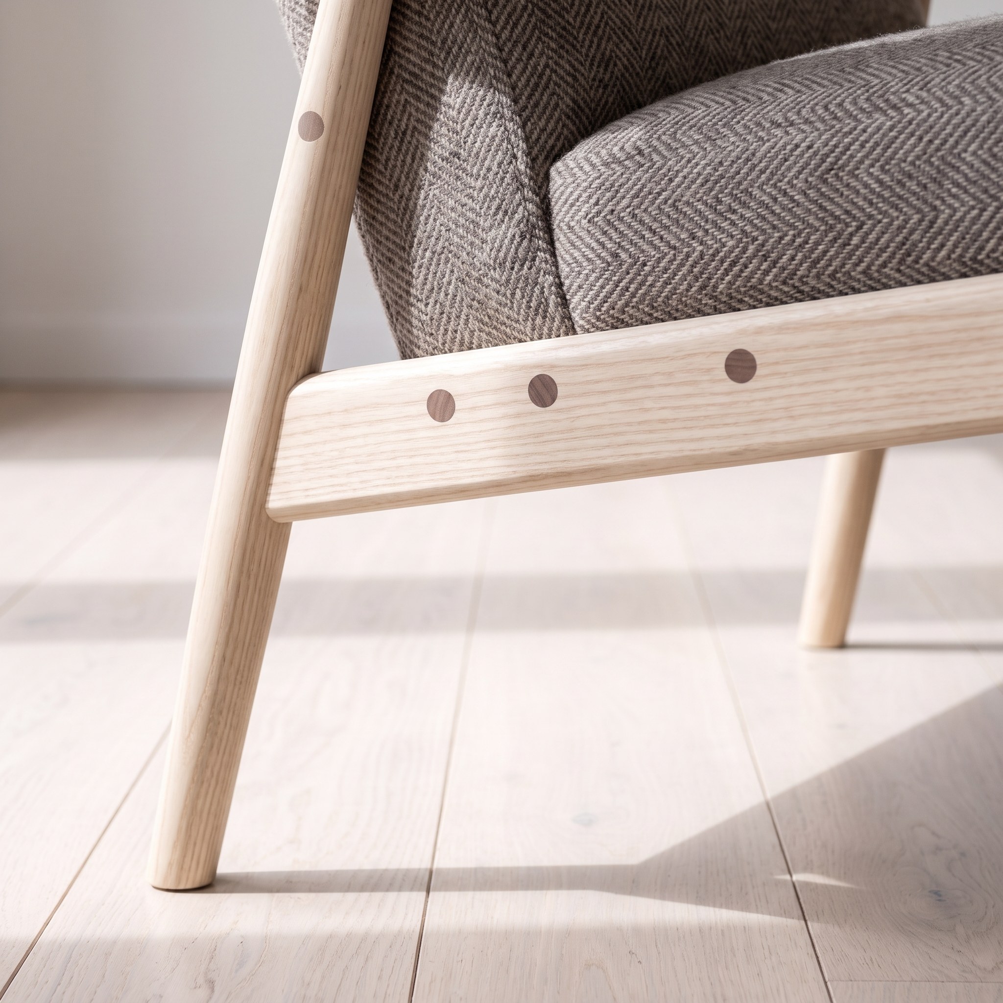 A close photograph of the joinery on Tweed High-Back Recliner