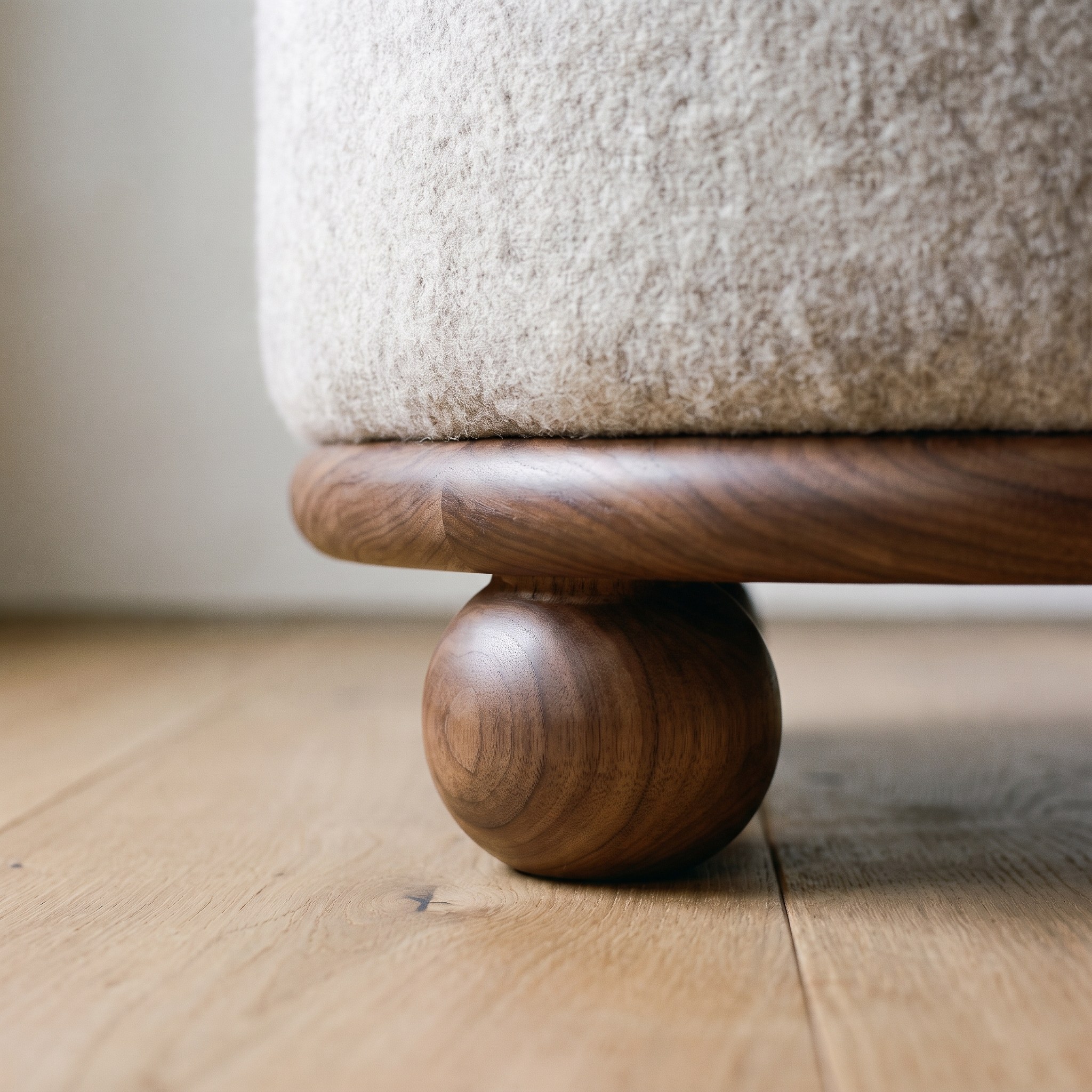A close photograph of the joinery on Alpaca Drum Ottoman
