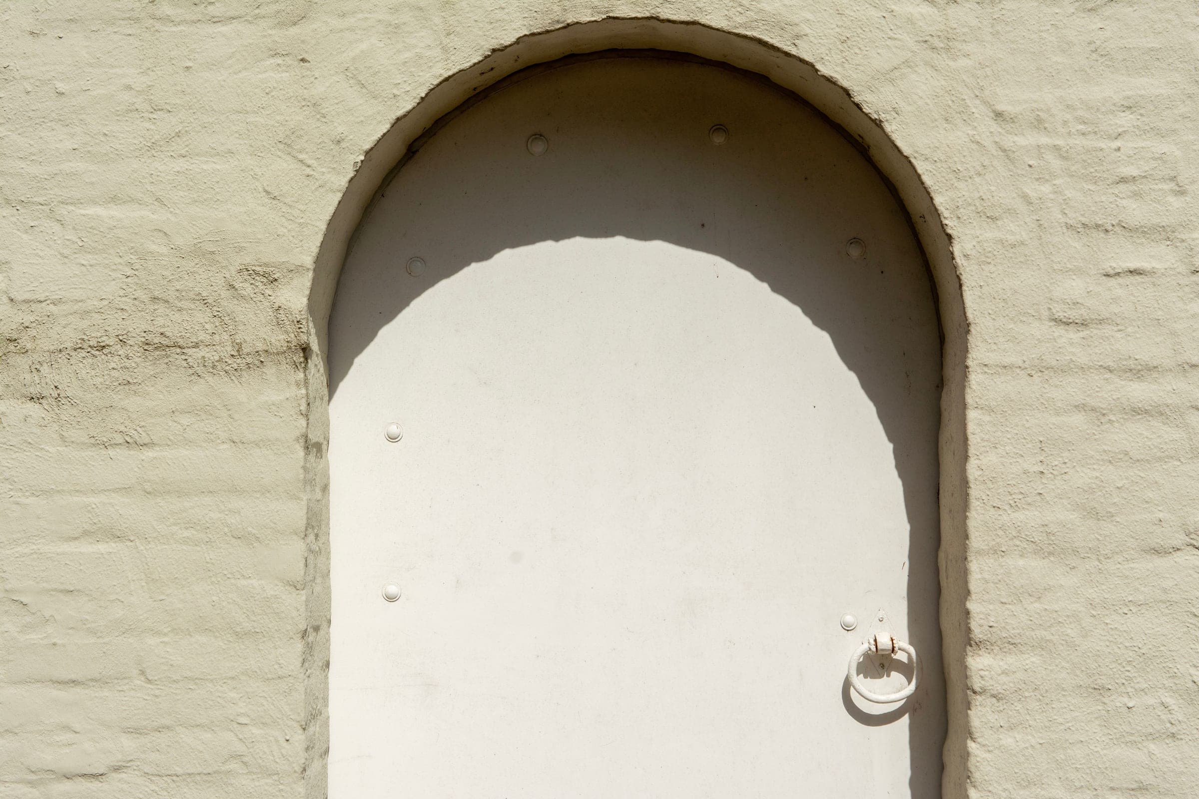 An empty doorway in warm daylight